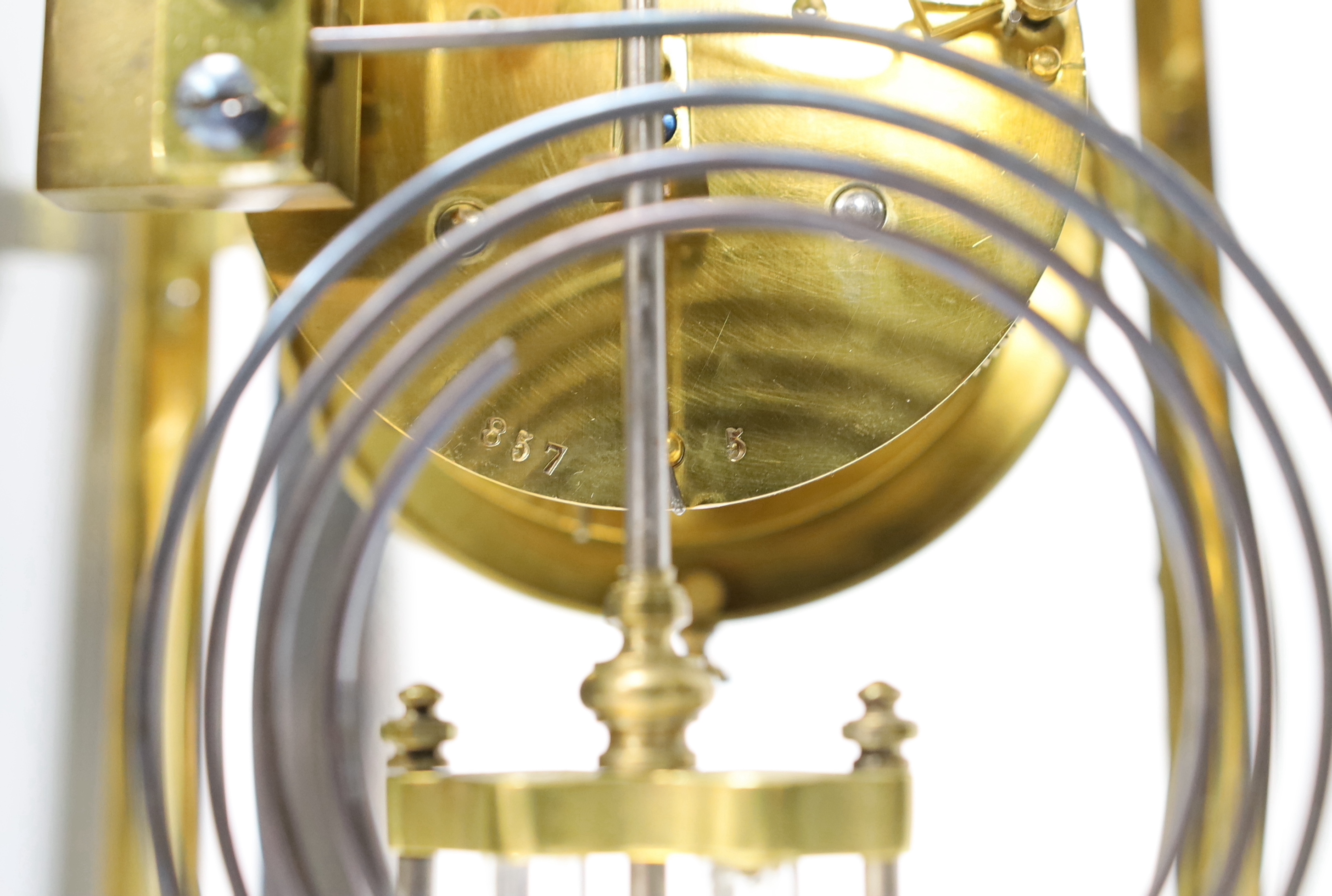 A 19th century French four glass clock, striking on a gong with mercury pendulum, 16.5cm wide x 28cm high